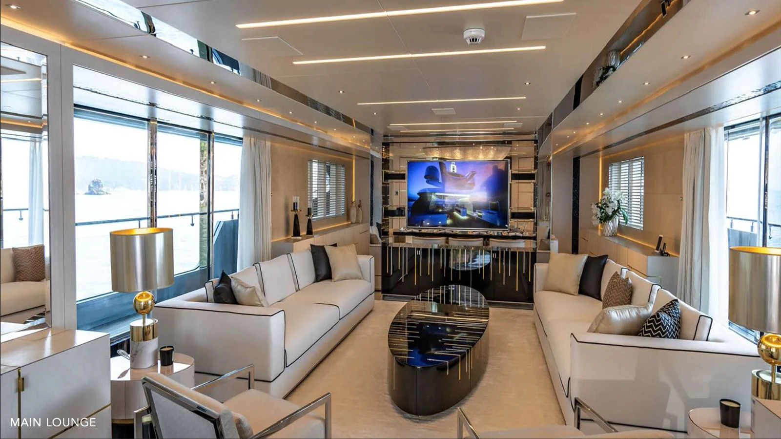 a living room with a large screen aboard MOONRAKER Yacht for Sale