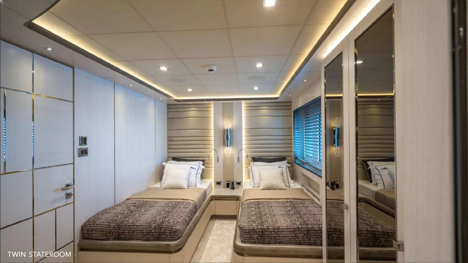a room with a bed and a couch aboard MOONRAKER Yacht for Sale