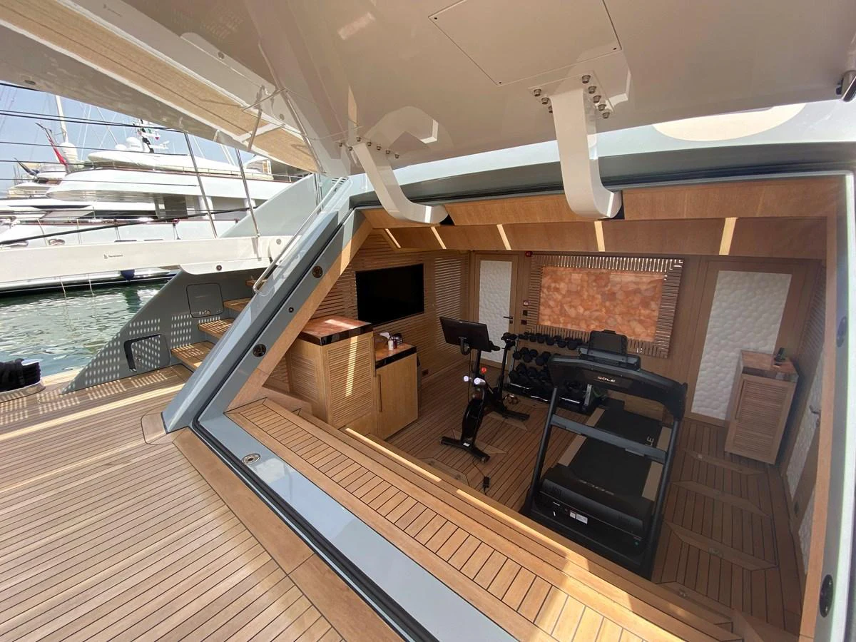 a boat with a deck and a desk aboard MOONRAKER Yacht for Sale