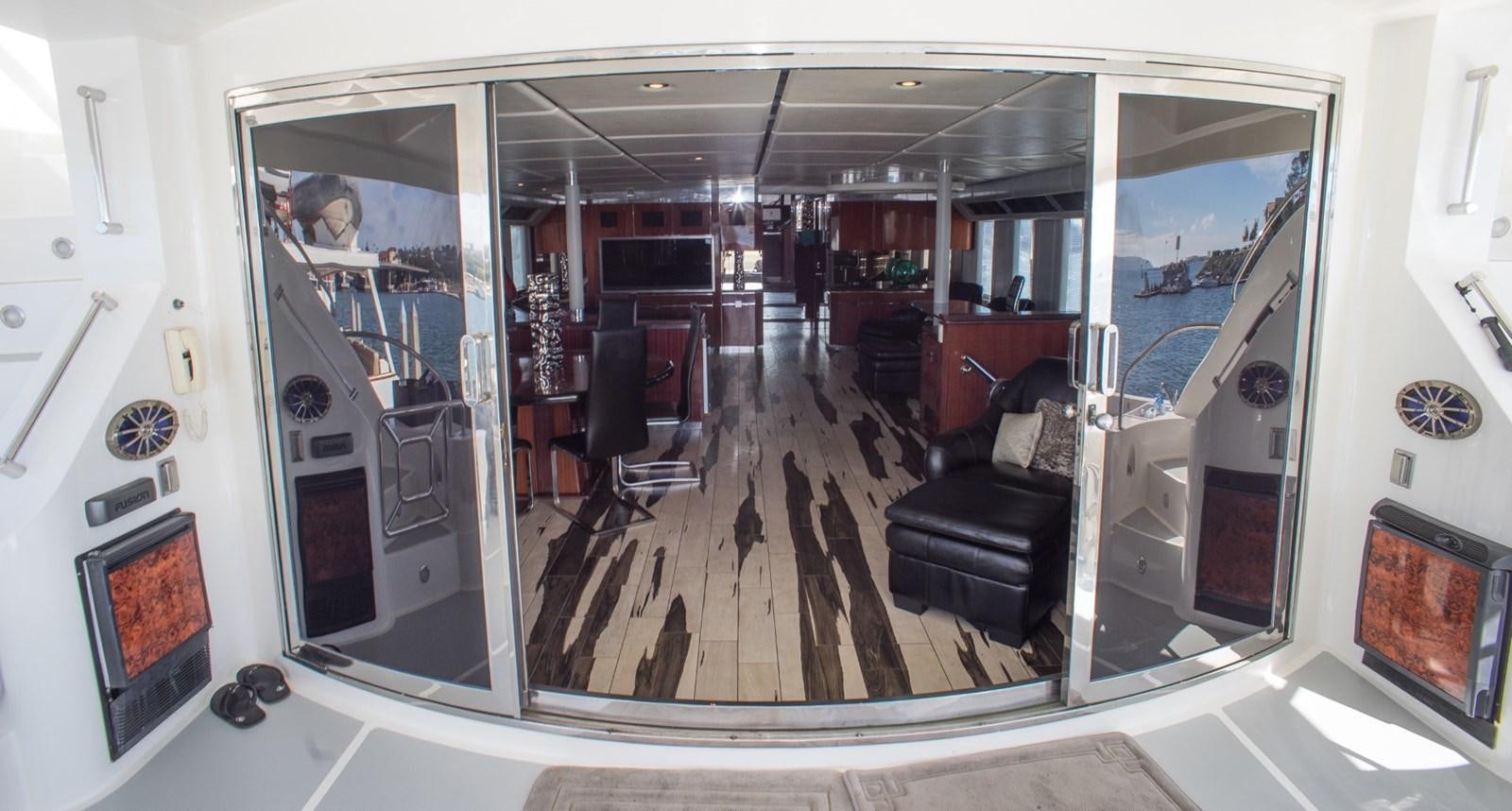 a room with a glass door aboard JACO Yacht for Sale