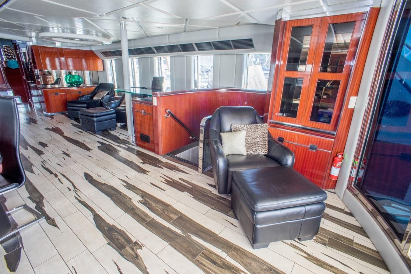 a room with chairs and a table aboard JACO Yacht for Sale