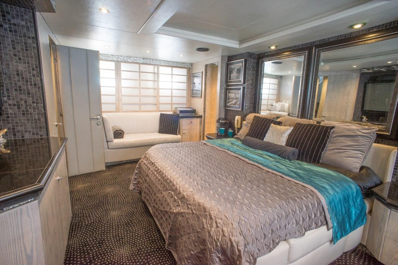 a bedroom with a bed and a bathtub aboard JACO Yacht for Sale