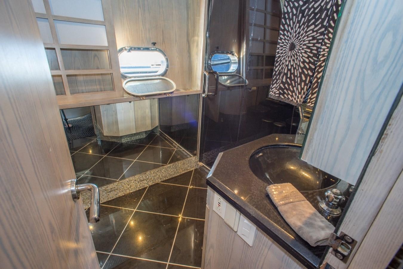 a bathroom with a sink and a mirror aboard JACO Yacht for Sale