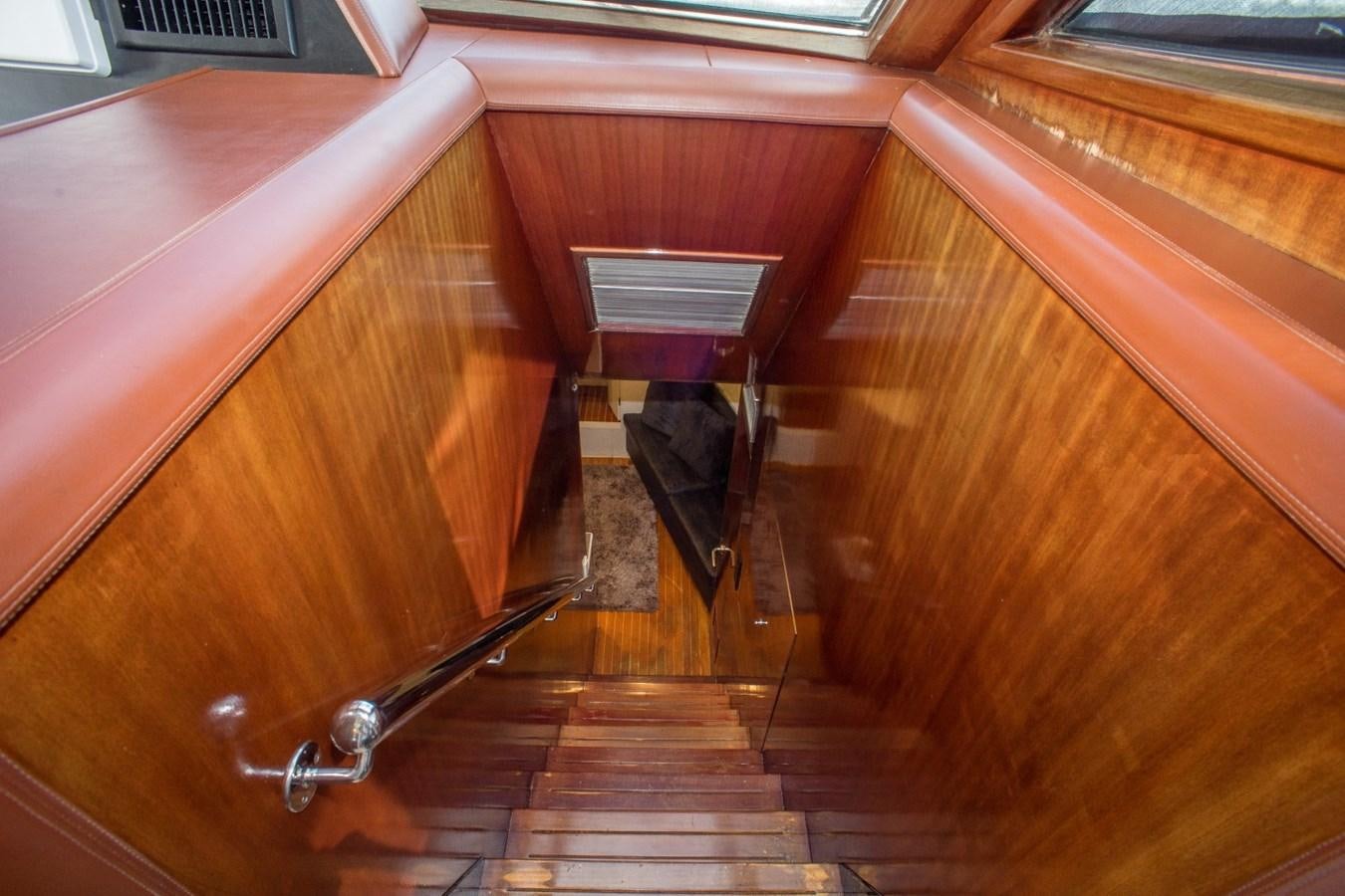 a wooden cabinet with a door aboard JACO Yacht for Sale