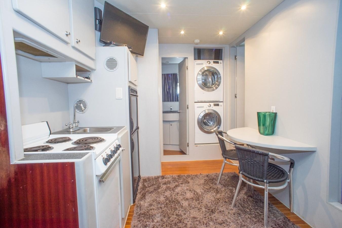 a kitchen with a sink and stove aboard JACO Yacht for Sale