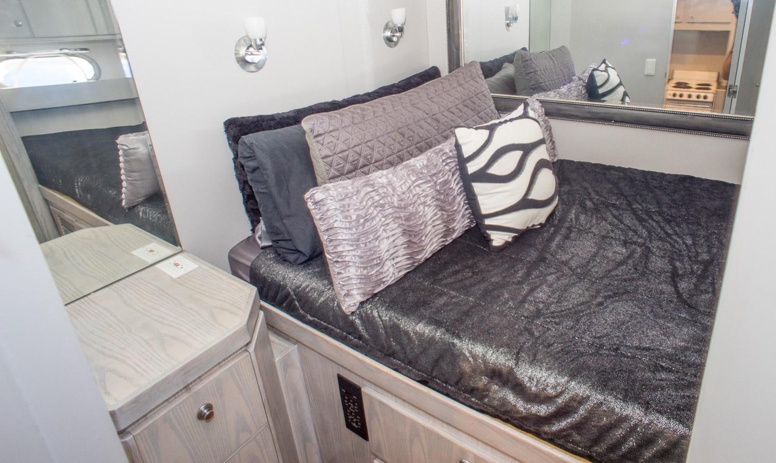 a bed with pillows aboard JACO Yacht for Sale