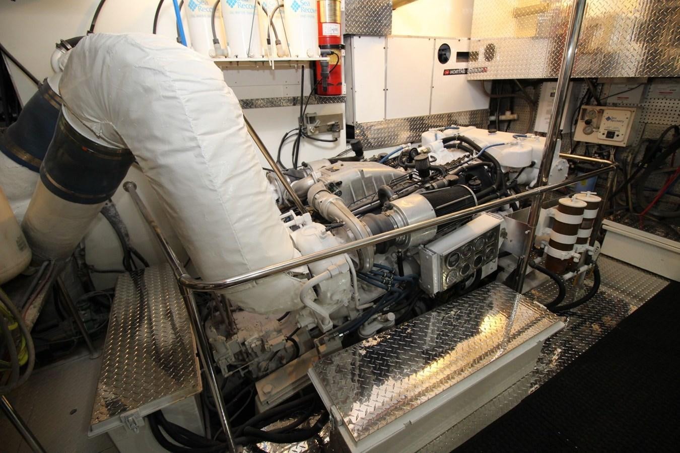 a person in a lab coat working on a machine aboard JACO Yacht for Sale
