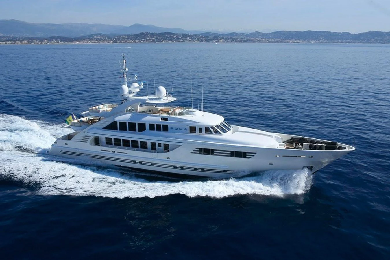 a white yacht on the water aboard ROLA Yacht for Sale