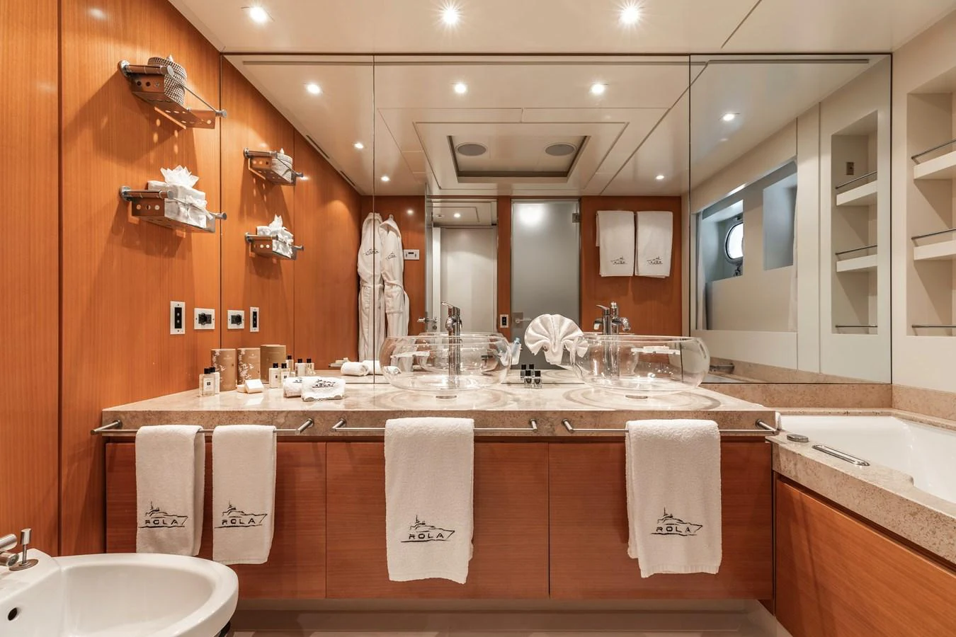 a bathroom with a large mirror aboard ROLA Yacht for Sale