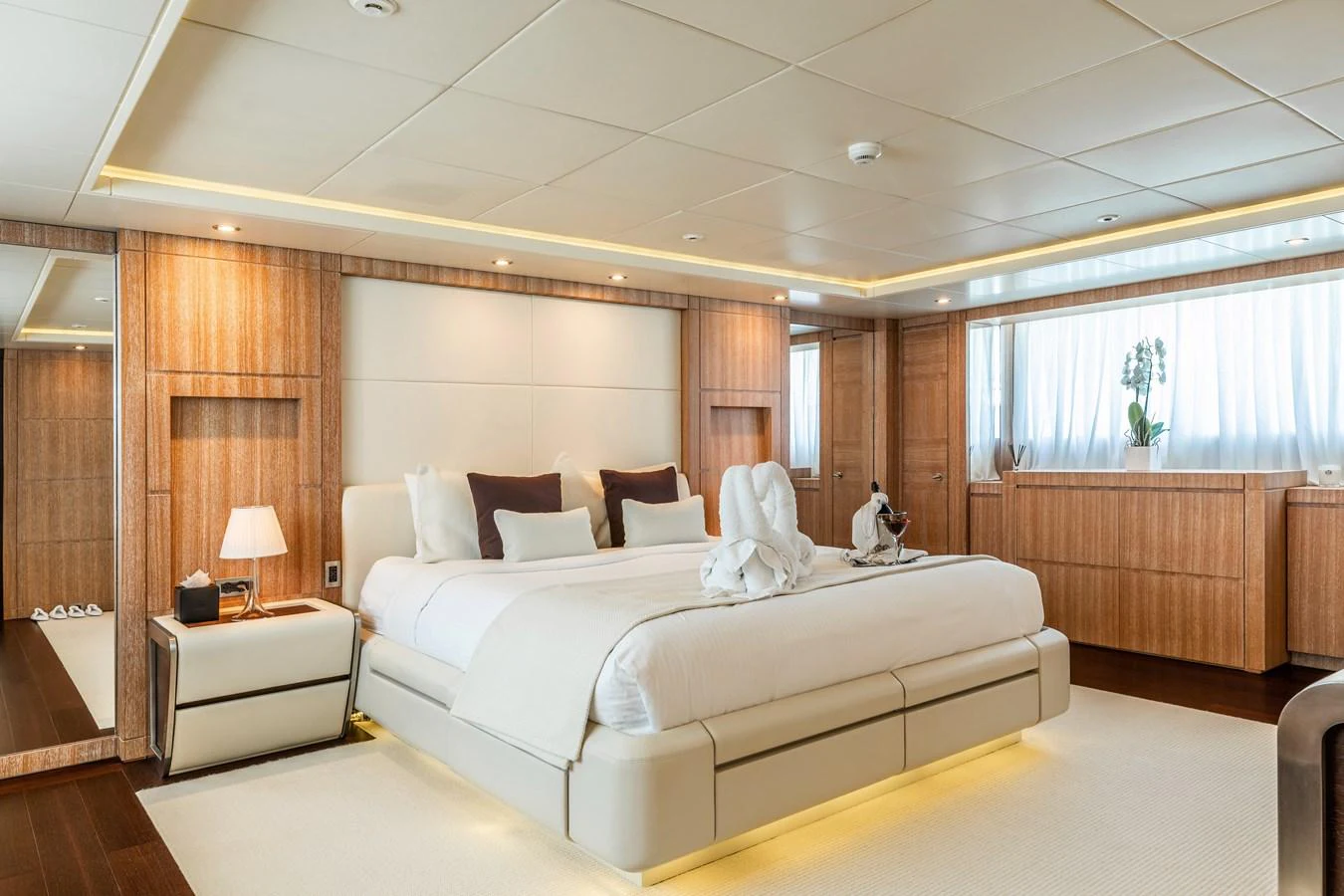 a large bedroom with a large bed aboard ROLA Yacht for Sale
