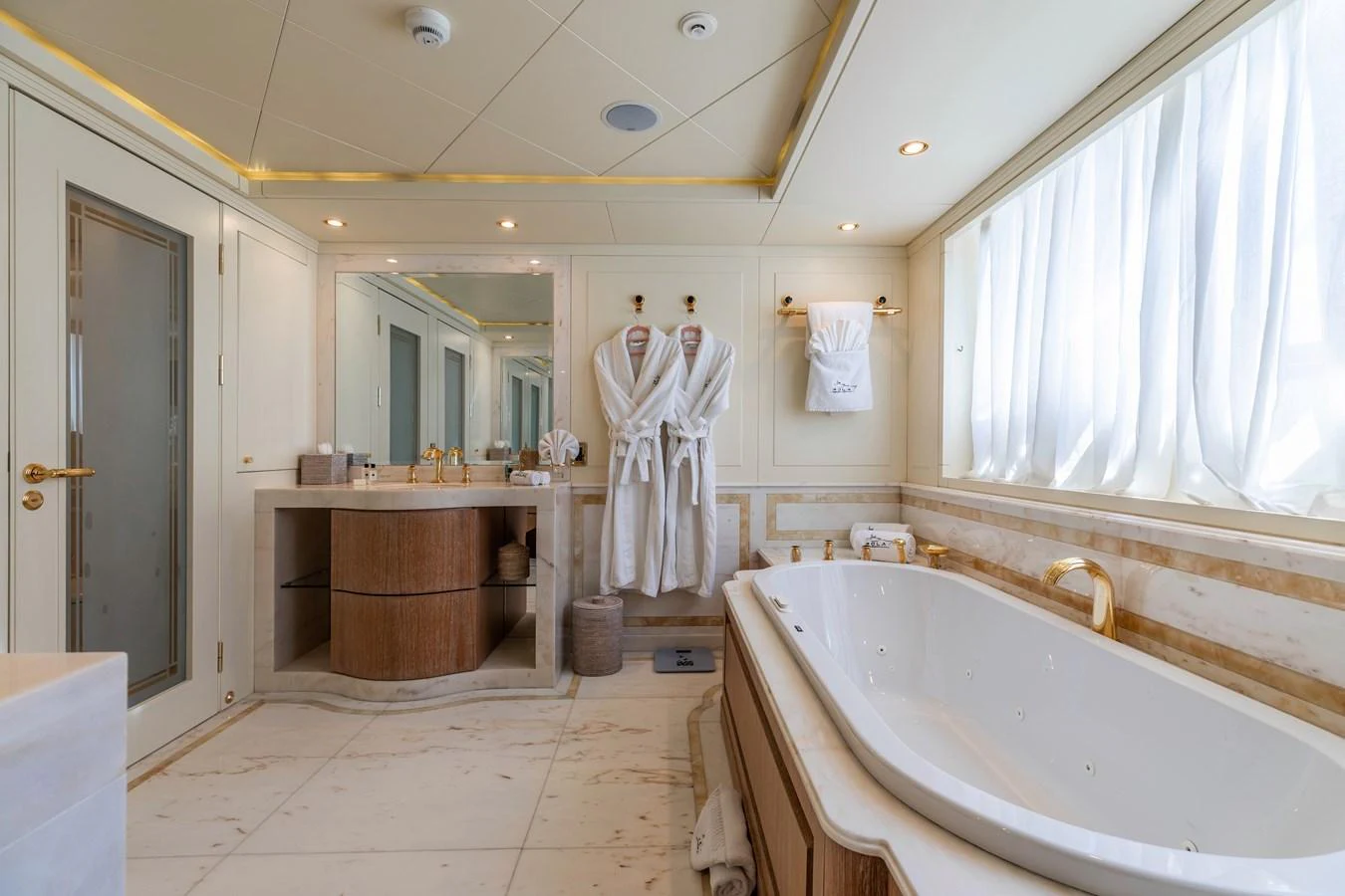 a bathroom with a bathtub and sink aboard ROLA Yacht for Sale