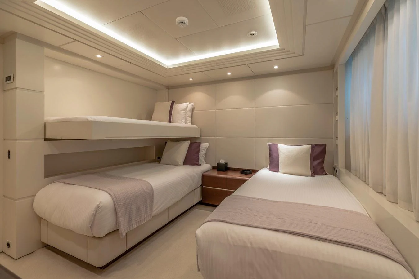 a room with two beds aboard ROLA Yacht for Sale