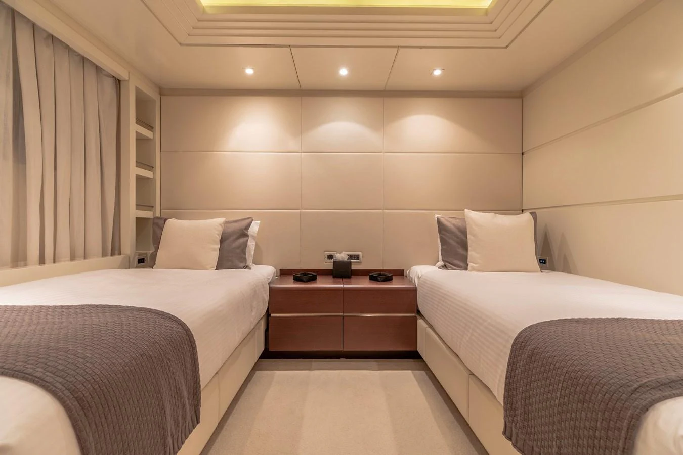 a room with two beds aboard ROLA Yacht for Sale
