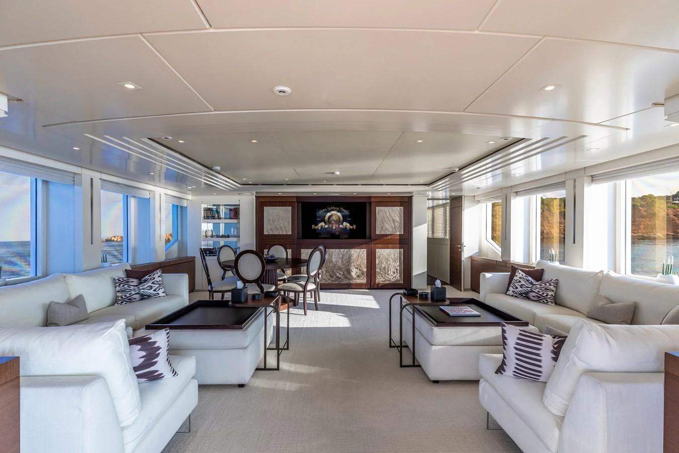 a living room with a couch and a table aboard ROLA Yacht for Sale