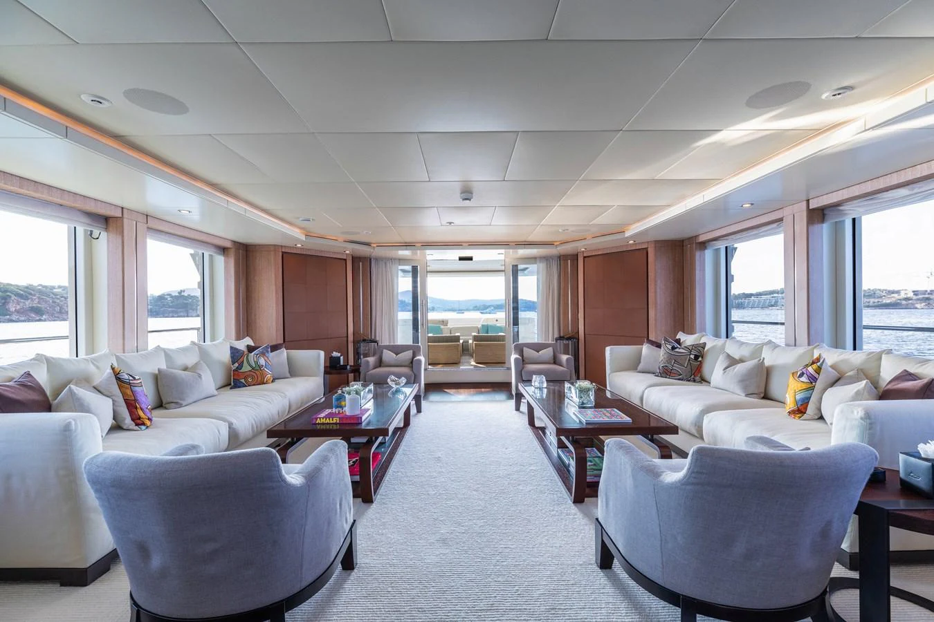 a living room with a couch and a table aboard ROLA Yacht for Sale