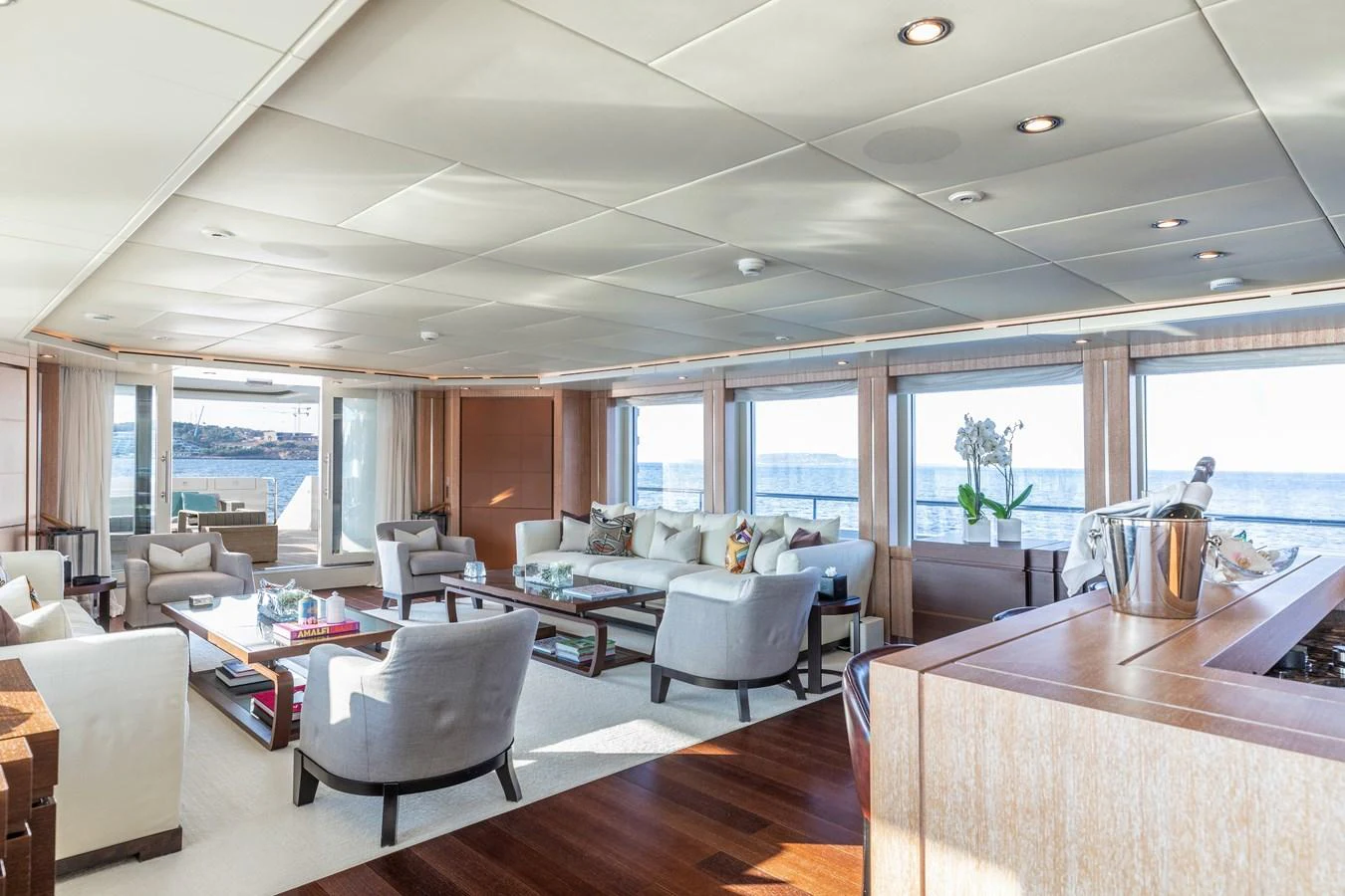 a living room with a large window aboard ROLA Yacht for Sale