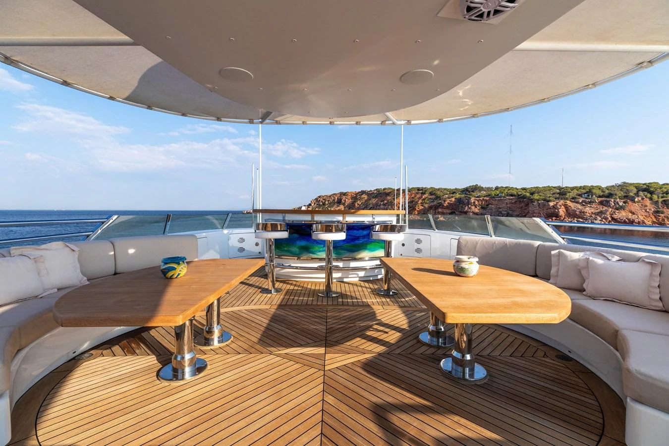 a room with a pool table and a deck with a view of the city aboard ROLA Yacht for Sale