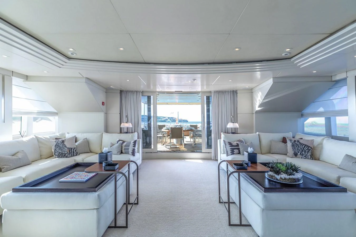 a living room with a large window aboard ROLA Yacht for Sale