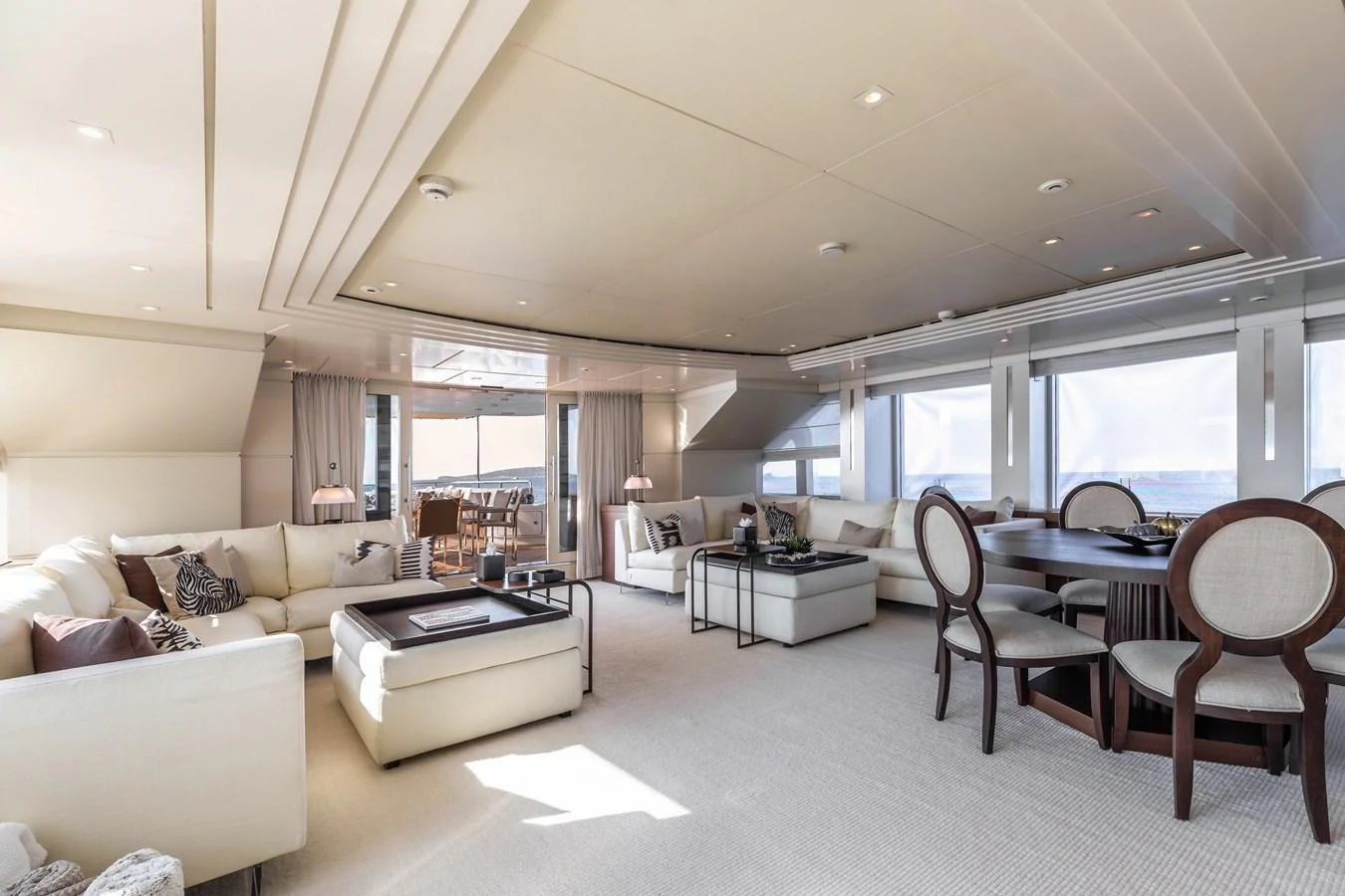 a living room with a couch and a table aboard ROLA Yacht for Sale