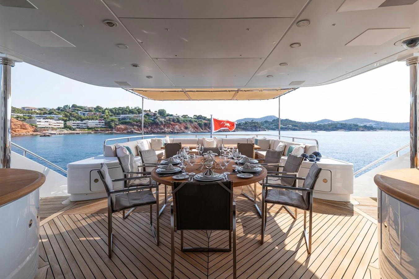 a table set for a meal on a deck aboard ROLA Yacht for Sale