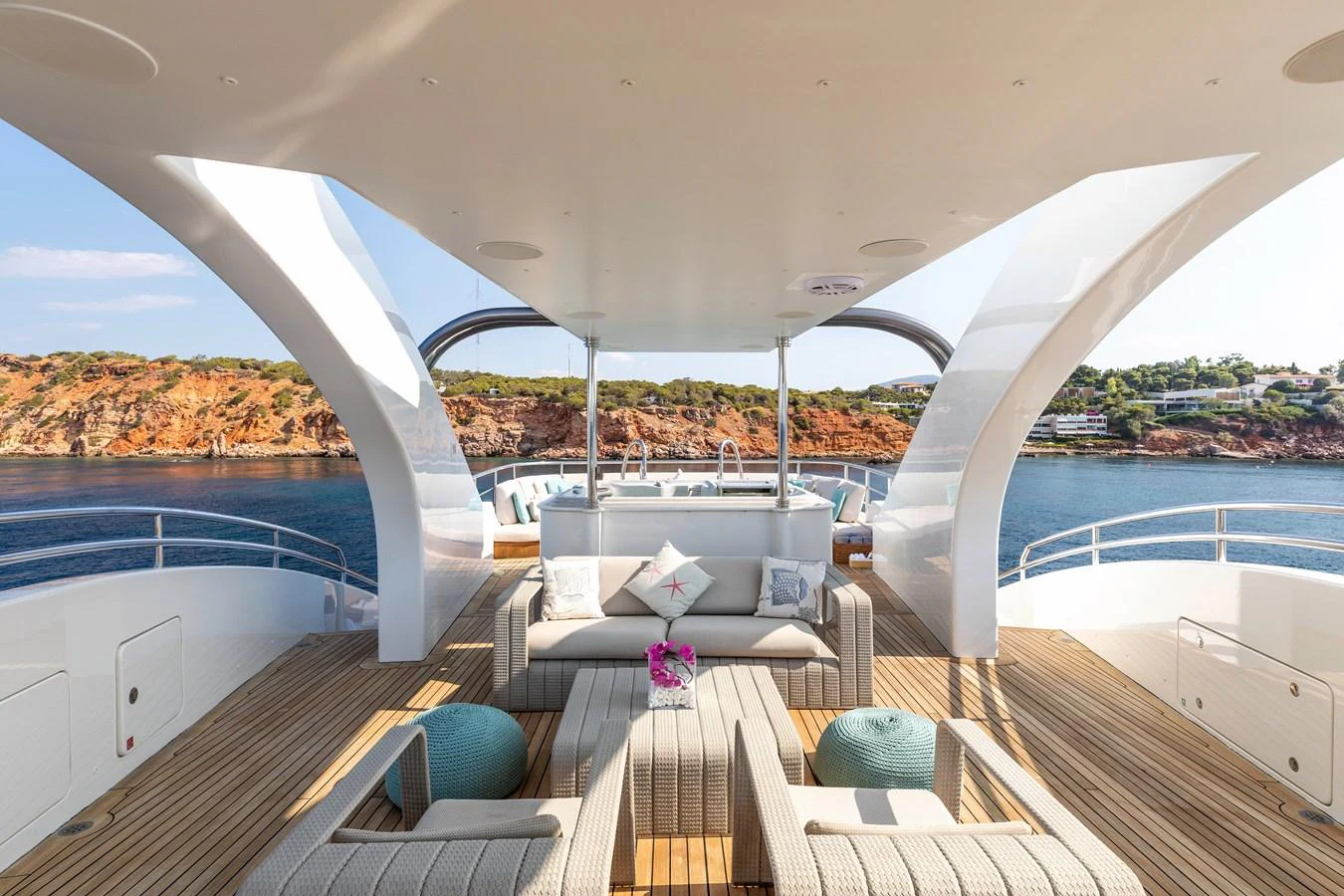 a room with a view of a city and a large body of water aboard ROLA Yacht for Sale