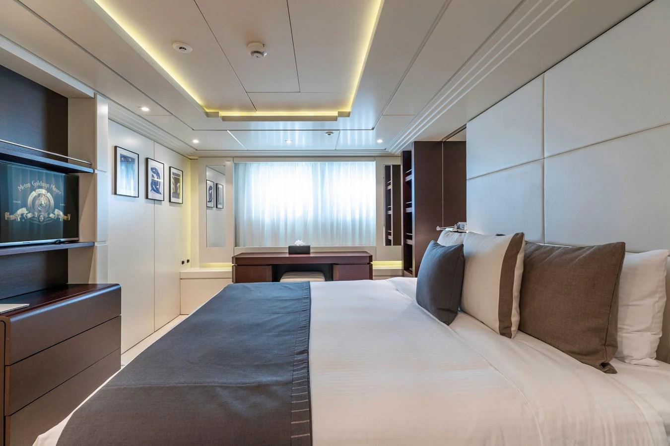 a bed with pillows aboard ROLA Yacht for Sale