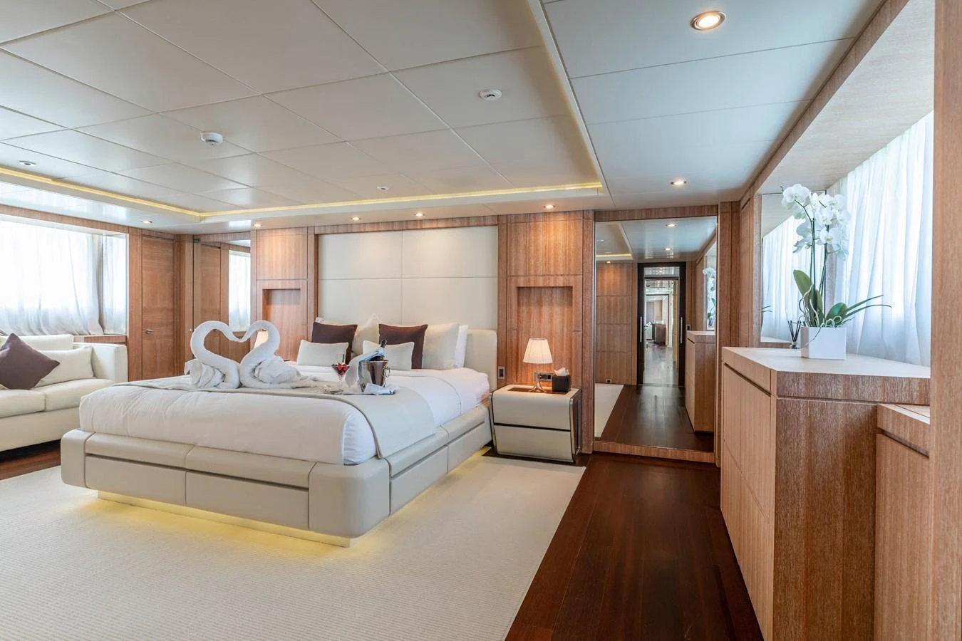 a large bedroom with a large bed aboard ROLA Yacht for Sale