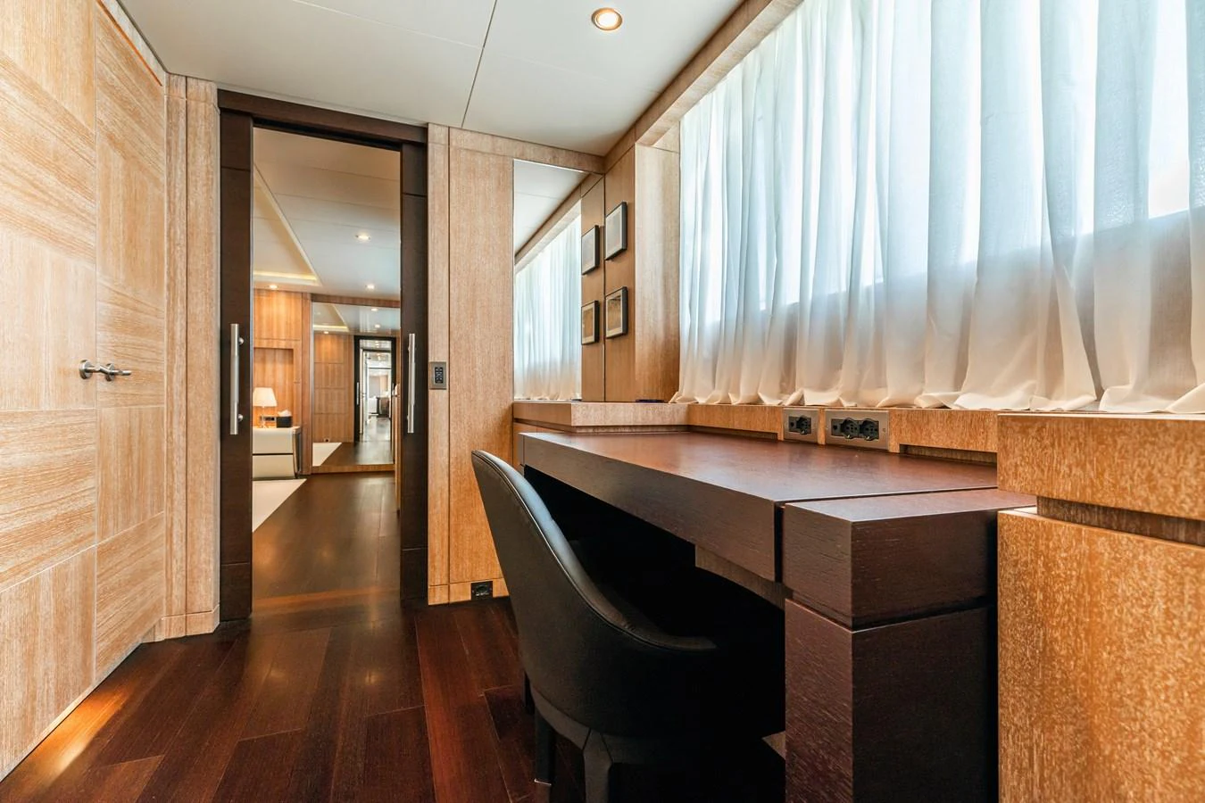a room with a desk and a chair aboard ROLA Yacht for Sale