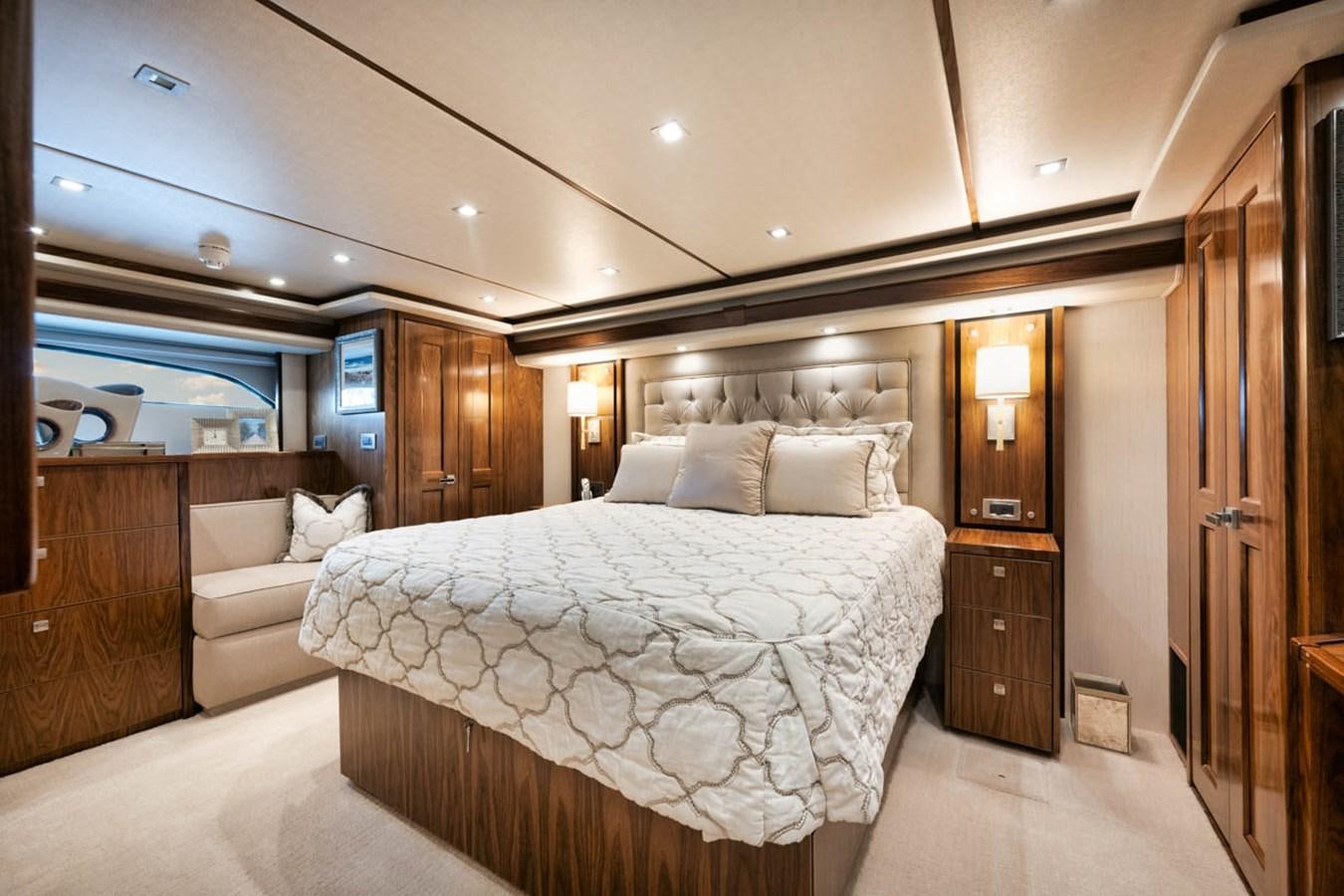 a large bedroom with a bed aboard MVP Yacht for Sale