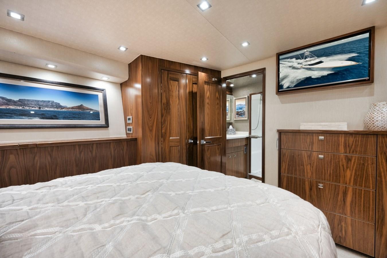 a bedroom with a large bed aboard MVP Yacht for Sale