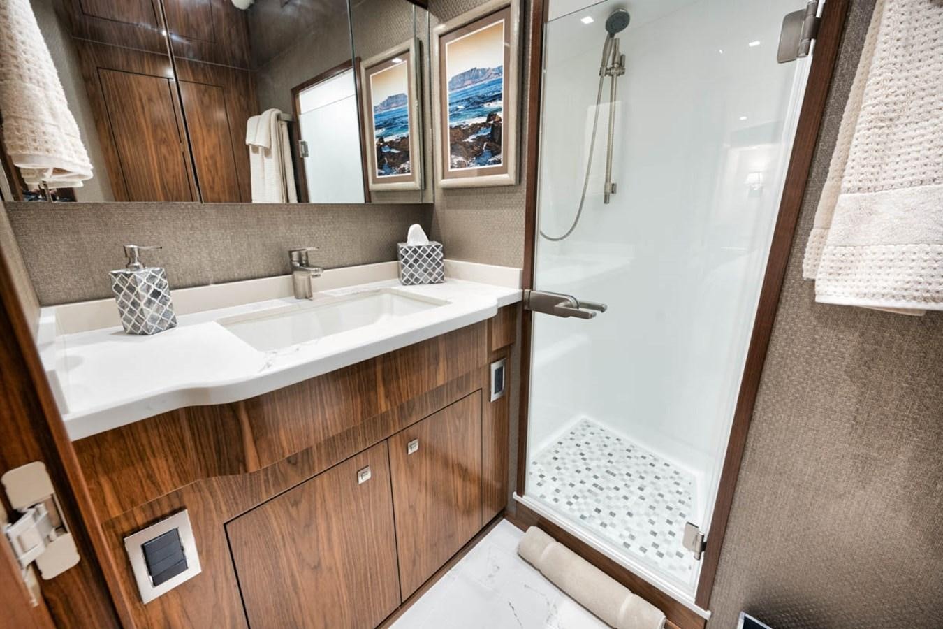a bathroom with a sink and a shower aboard MVP Yacht for Sale