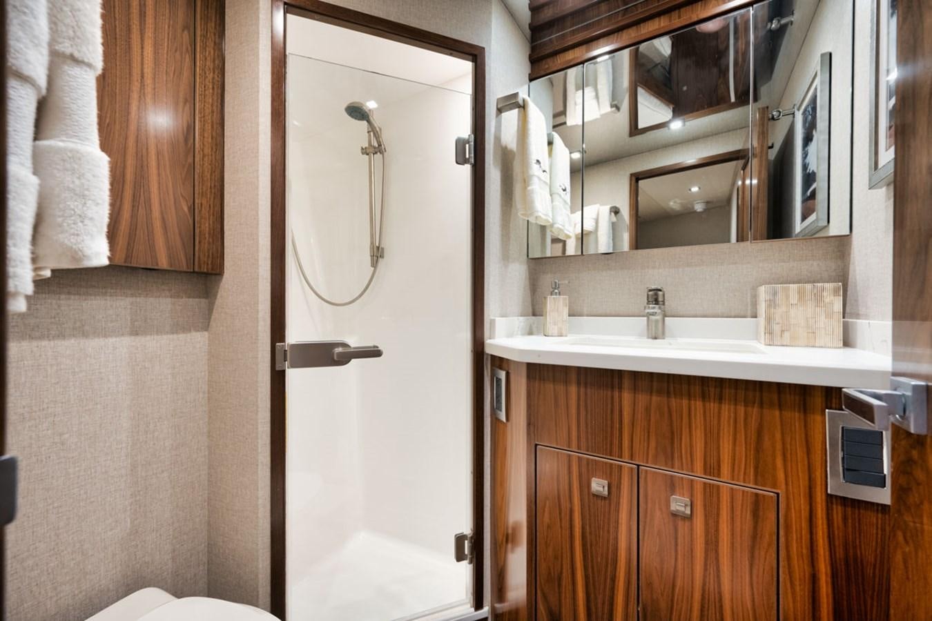 a bathroom with a sink and a mirror aboard MVP Yacht for Sale
