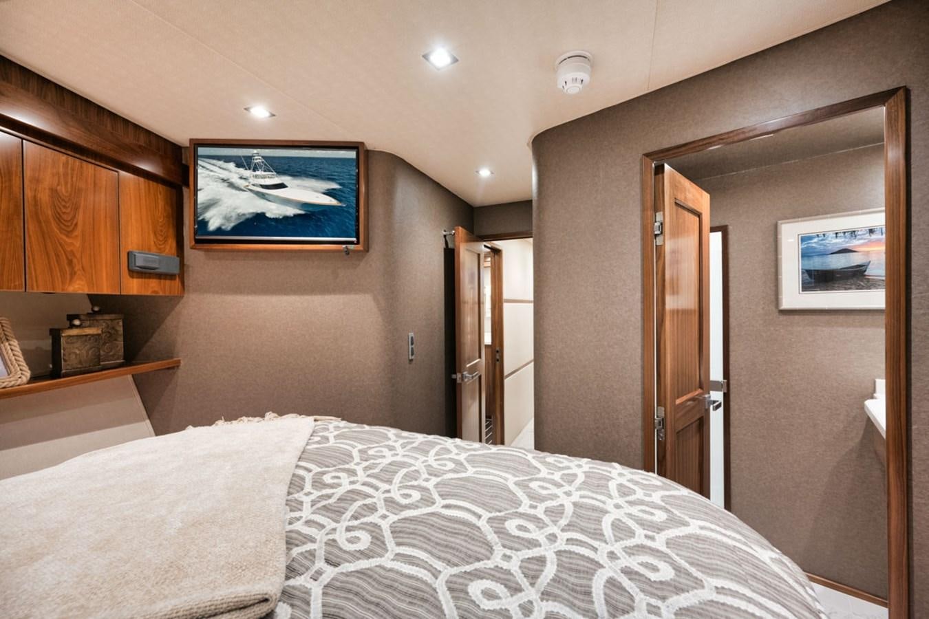 a bedroom with a bed aboard MVP Yacht for Sale