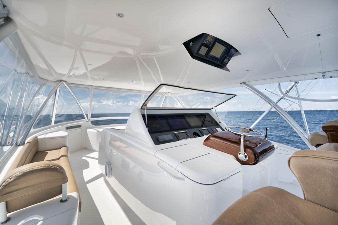 a yacht with a white roof aboard MVP Yacht for Sale