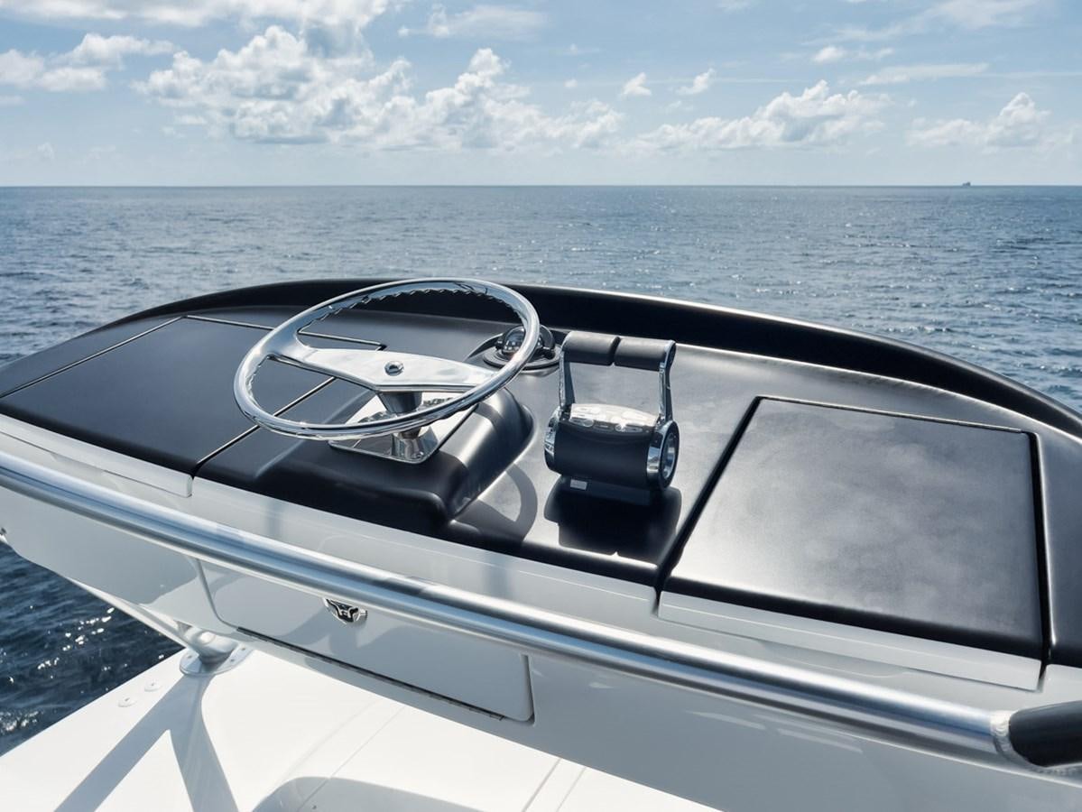 a car with a view of the ocean and land below aboard MVP Yacht for Sale