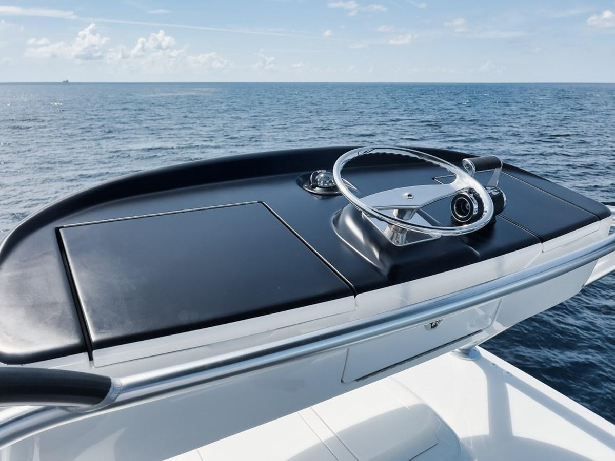 a car driving on a body of water aboard MVP Yacht for Sale