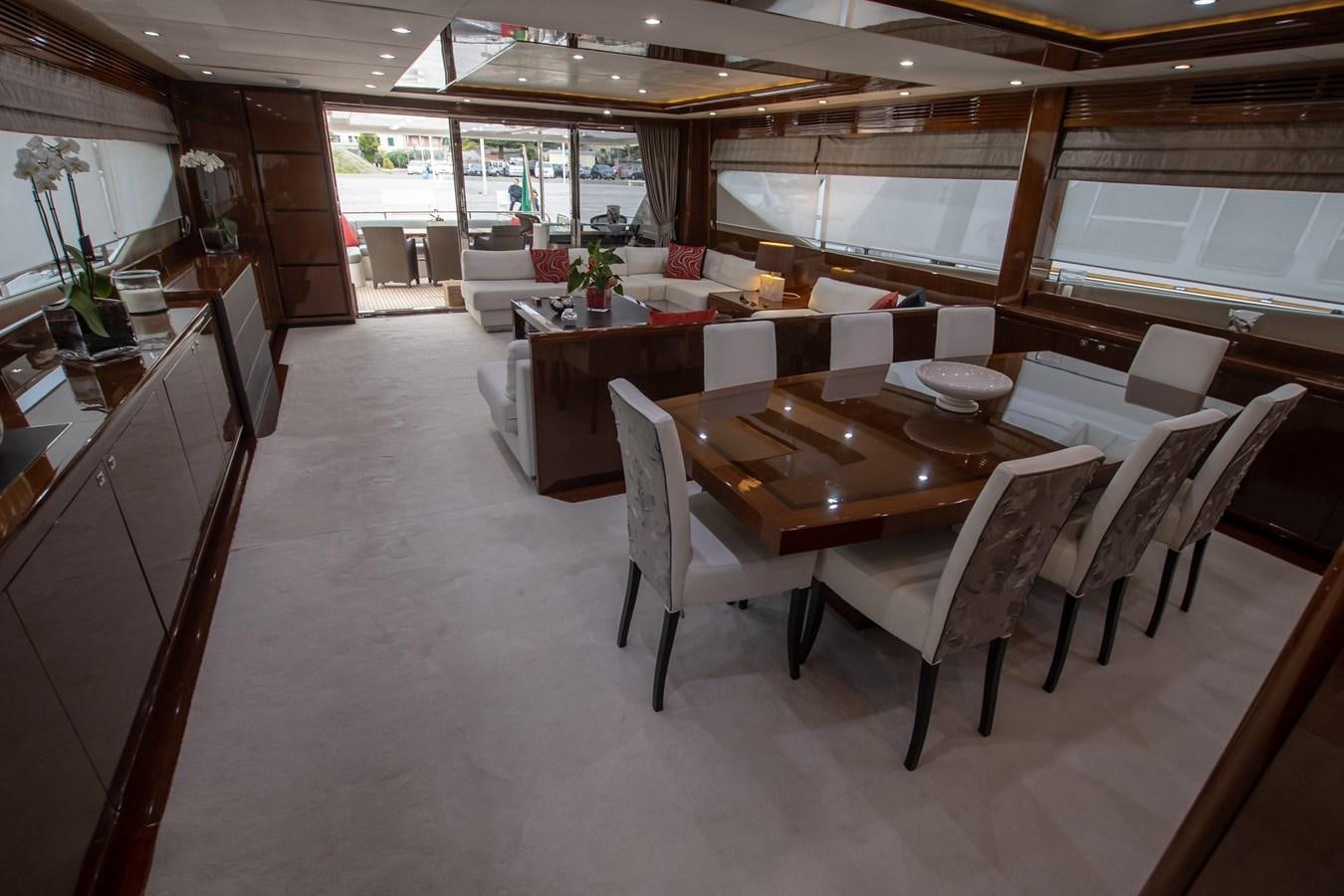 a room with tables and chairs aboard ROSSO Yacht for Sale