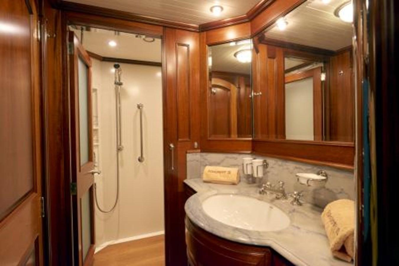a bathroom with a sink and a mirror aboard BORKUMRIFF IV Yacht for Sale