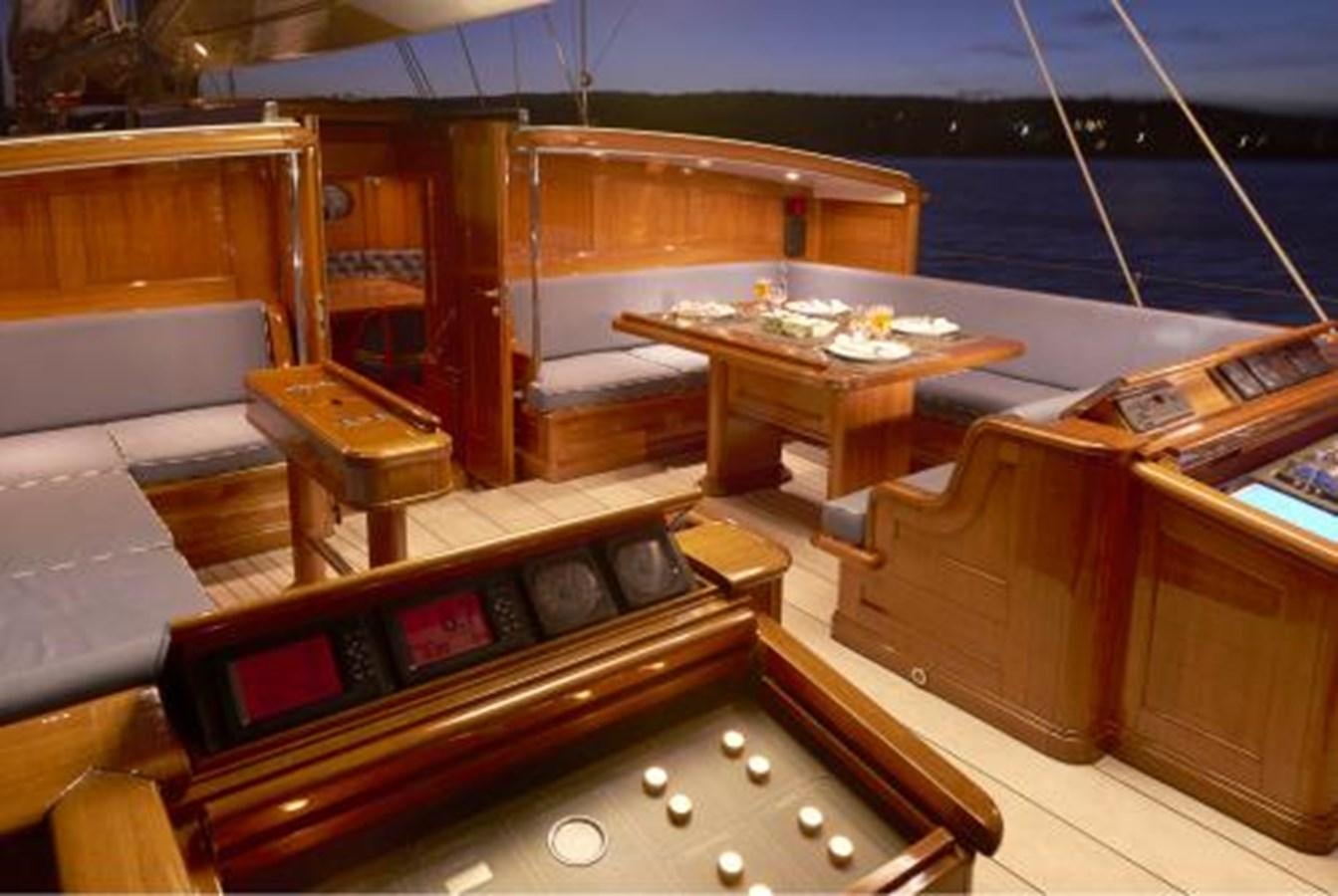 a boat with a table and chairs aboard BORKUMRIFF IV Yacht for Sale