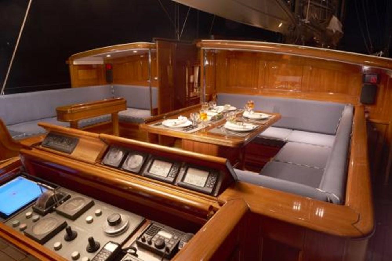 a wooden desk with a computer aboard BORKUMRIFF IV Yacht for Sale