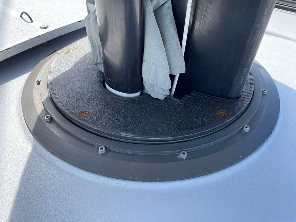 a white gloved hand holding a black object with a white substance on it aboard BLACK JACK IV Yacht for Sale