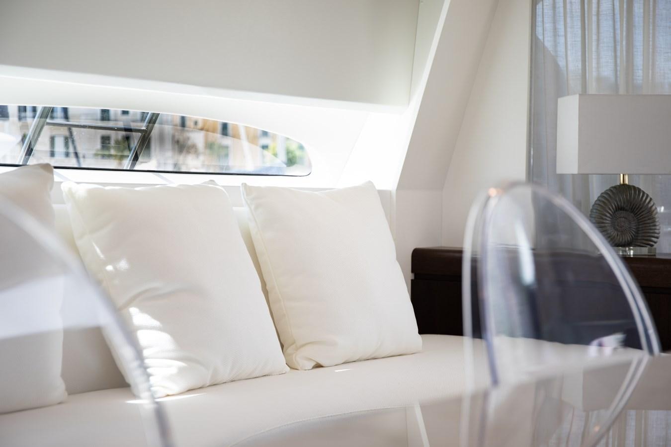 a white bed with white sheets aboard VEVEKOS Yacht for Sale