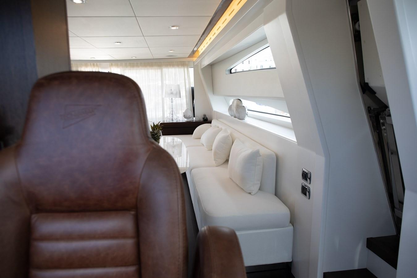 a person sitting on a couch aboard VEVEKOS Yacht for Sale