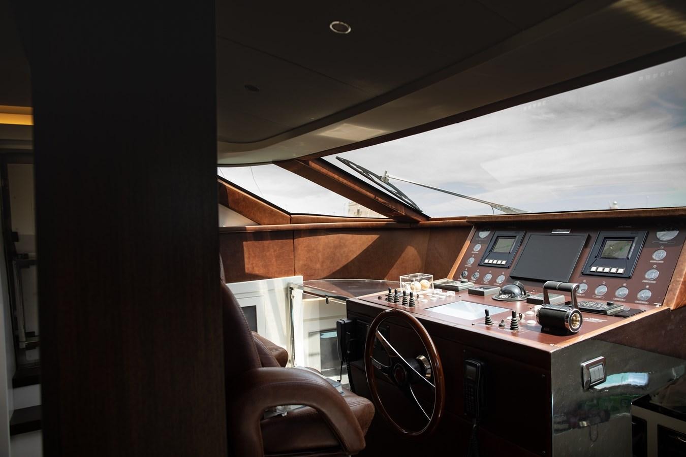 a room with a desk and computer aboard VEVEKOS Yacht for Sale