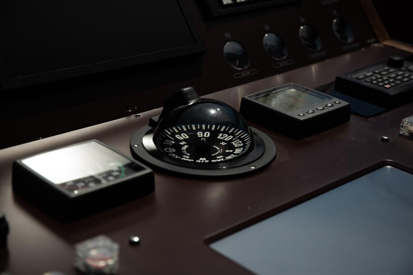 a record player and a radio on a table aboard VEVEKOS Yacht for Sale