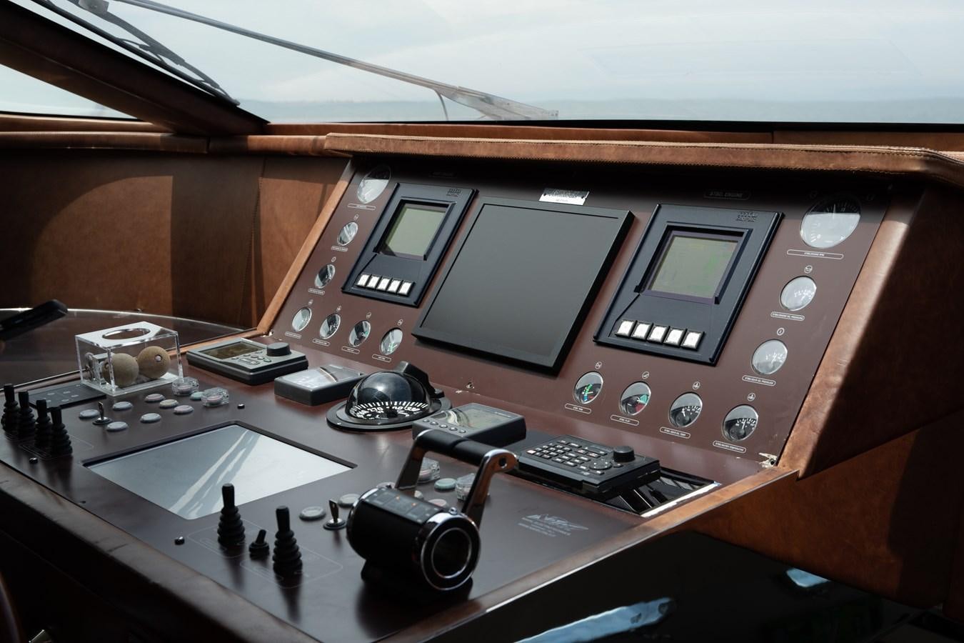 a group of electronic devices on a table aboard VEVEKOS Yacht for Sale