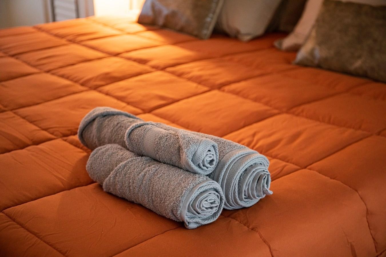 a pair of pillows on a couch aboard VEVEKOS Yacht for Sale