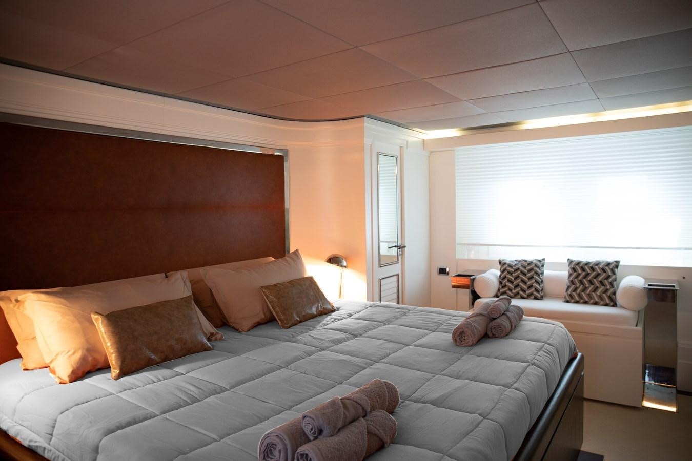 a large bed in a room aboard VEVEKOS Yacht for Sale