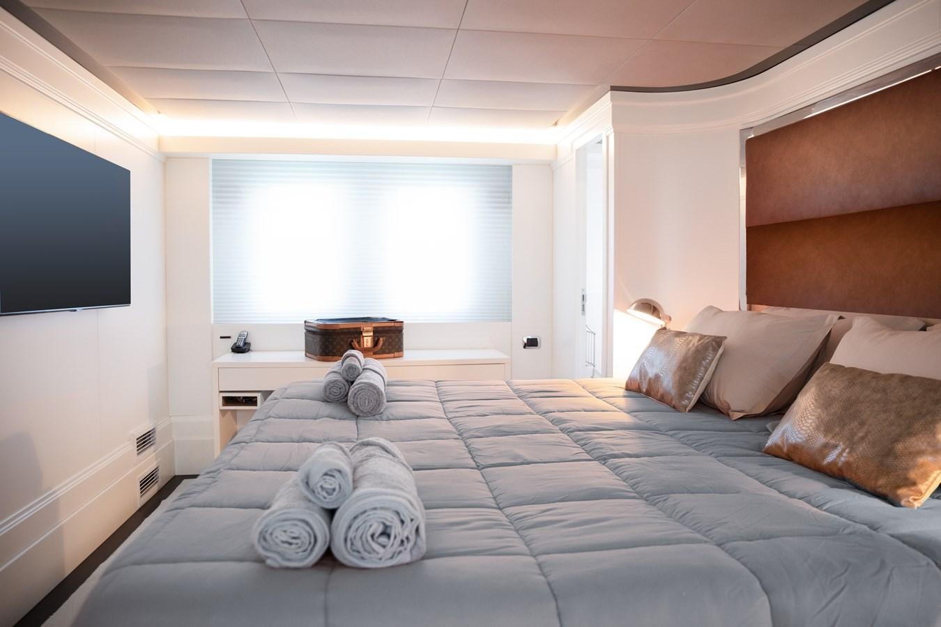 a large bed with pillows aboard VEVEKOS Yacht for Sale