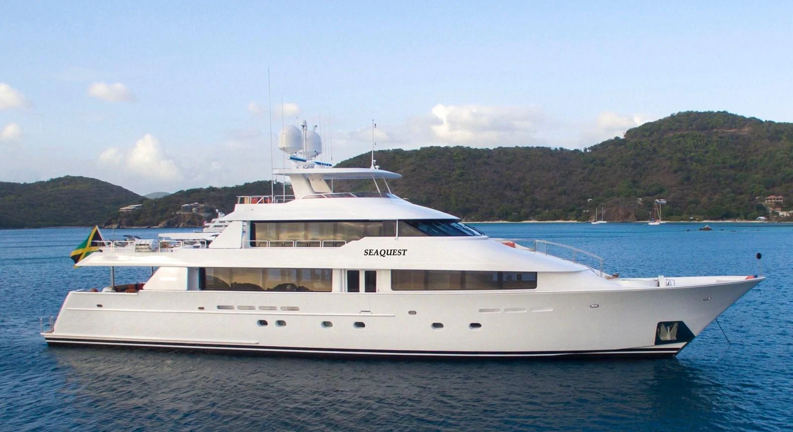 a white yacht on the water aboard SEAQUEST Yacht for Sale
